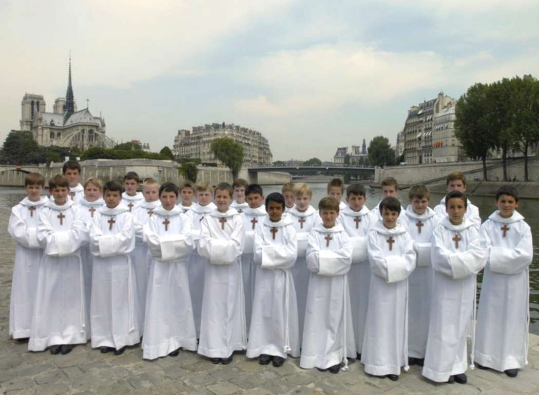 Les Petits Chanteurs à la Croix de Bois, with the Cathedral of Notre-Dame in the background